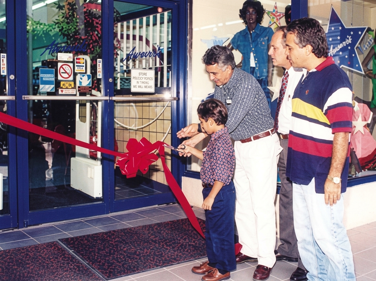The Ammar family ribbon cutting ceremony at their new uptown store location