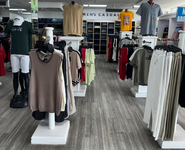 Sleek mannequin displays and clothing racks in Men's Casuals section